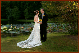 Wedding couple outdoors by lake